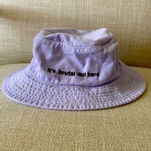 Olivia Rodrigo “it’s brutal out here” lavender bucket hat